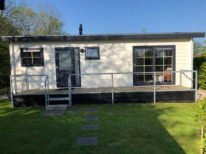 Chalet in a holiday park by Wadden Sea